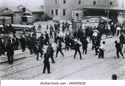 Polish oil refinery workers in Bayonne, New Jersey, confront company guards outside the Standard Oil Works moments before the private police opened fire. Five strikers were killed. July 22, 1915.