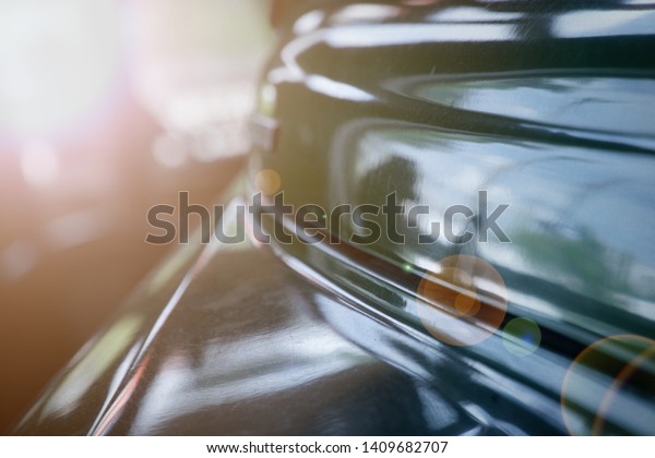 Polished car body with light\
reflection, sunny bunny on old vintage car, business\
consept.