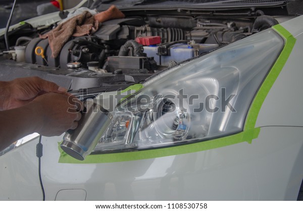 Polished car\
headlights using a steam\
engine.