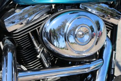 Polished Chrome Elements Of A Motorbike Engine With Reflection, As Closeup