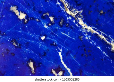 Polished lapis lazuli plate measuring 24x36 mm. From the Siberian deposits.