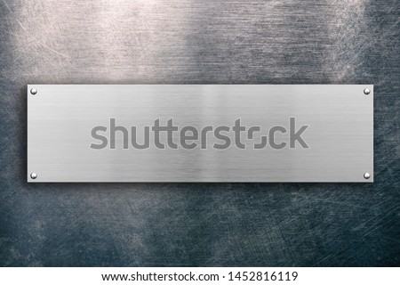 Polished metallic plate on steel background