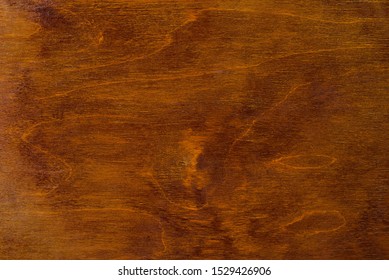 Polished wood surface. The background of polished wood texture.