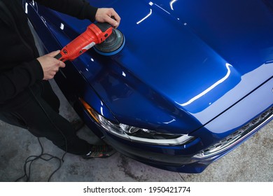 Polishing car after painting. Detailing car from the outside. Device for polishing in hands