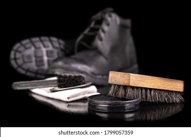 Polishing And Cleaning Leather Shoes With A Brush. Cleaning Work Shoes. Dark Background.