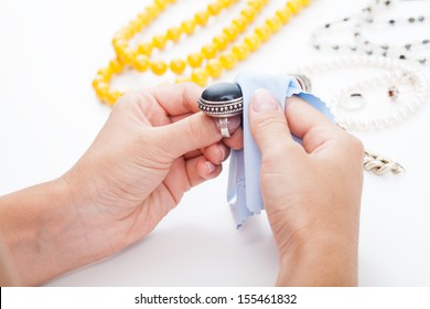 Polishing Silver Old-fashioned Jewellery With A Cloth