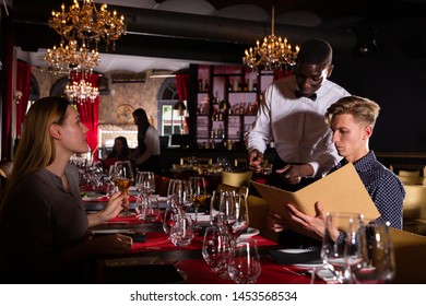 Polite Africanamerican Waiter Bringing Ordered Dishes Stock Photo ...