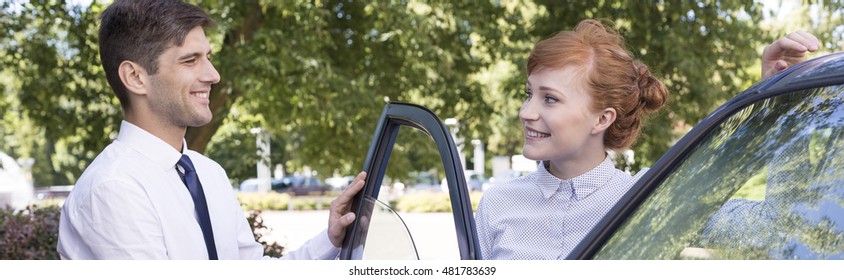 Polite Man Opening The Car Door To The Smiled Woman