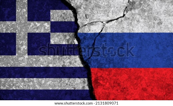 Political relationship between Greece\
and russia. National flags on cracked concrete\
background
