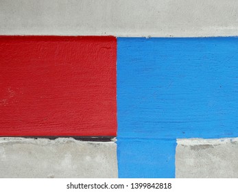 politics in gridlock - red and blue color blocks clash on concrete. 