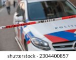 Politie, Dutch police. Close up of barrier tape or afzetlint with text: 