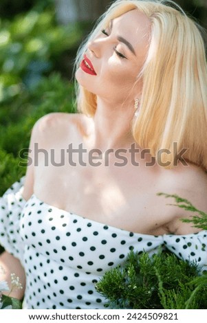 Polka Dot Blossom: Young Blonde Girl with Bouquet