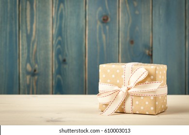 Polka Dot Gift Box On Wooden Table