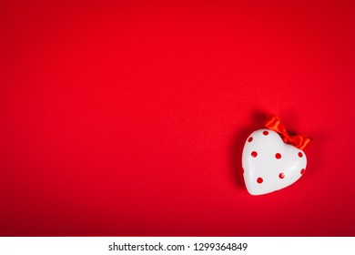 Polka dot heart. White heart on red background. Copy space