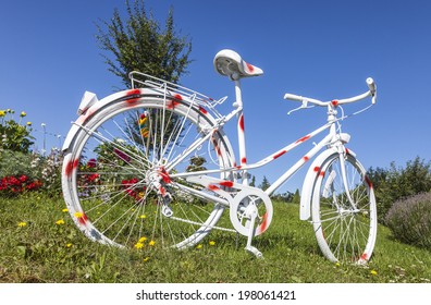 Polka Dot Painted Vintage Bicycle Decorating A Filed Of Flowers In A Small Town Where Tour De France Pass.