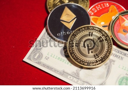 Polkadot DOT, bitcoin, Ethereum ETH, Shiba Coin, included with Crypto currency coin  on stack 100 hundred new US dollar Money American Virtual blockchain technology future is money Close up concept