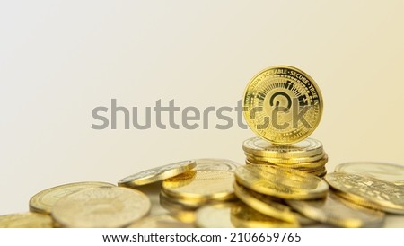 Polkadot or Dot cryptocurrency standing on pile of gold crypto coins with copy space.