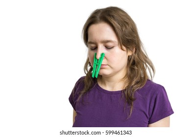 Pollen Allergy Concept. Young Woman Cant Breathe And Wearing Peg On Her Nose. Isolated On White Background.