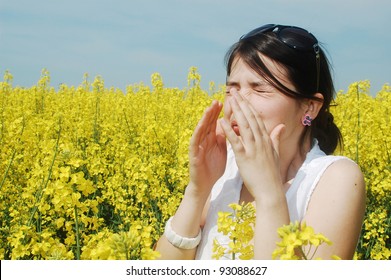 Pollen Allergy, Girl Sneezing In A Field Of Flowers