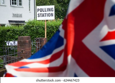 polling station sign and Union Jack flag - UK prepares for elections