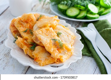 Pollock Fillet In Batter On A White Plate, Selective Focus