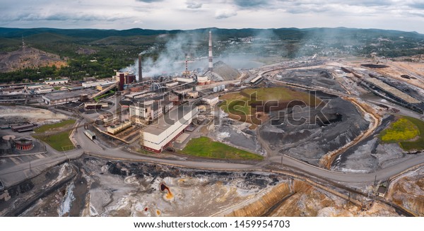 Polluted terrain, industrial site, copper plant;\
problem with modernization and renovation; air contamination and\
harmful gases emissions; zone of ecological catastrophe; aerial,\
drone flying forward