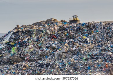 Pollution concept. Garbage pile in trash dump or landfill. - Shutterstock ID 597557036
