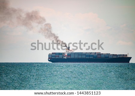 Pollution container ship, Container ships in the sea have a lot of black smoke, Green earth concept.