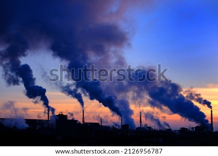 Pollution smoke from a factor plan in the air with sky bad for the environment