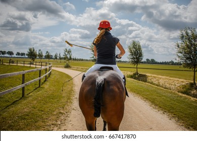 Polo Horse Riding Woman On Gravel Road, Dramatic Look On Sunny Day