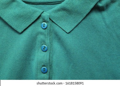 Polo Shirt Close Up View Of Persian Green Color Tone Clothes. Dark Green And Light Blue Colour Mix T-shirt, Buttoned Up Polo Top View On The Clothing Store Aisle 