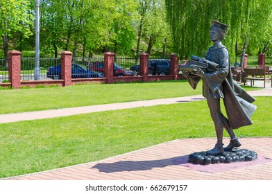 POLOTSK, BELARUS - MAY 19, 2017: Monument To Polotsk Student On Territory Of Former Jesuit Collegium (now - Polotsk State University). Medieval Scholar Carries Books And Manuscript With Seal