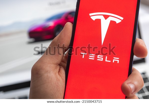 Poltava, Ukraine - April 26, 2022: Tesla electric logo\
background. Elon Musk, Business and transportation of future\
concept 
