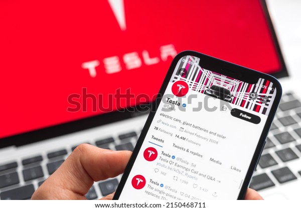 Poltava, Ukraine - April 26, 2022: Tesla electric\
car logo background. Elon Musk, Business and transportation of\
future concept