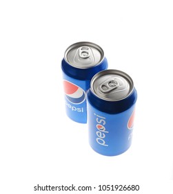 POLTAVA, UKRAINE - MARCH 22, 2018: two Pepsi Cans with Isolated On White. Pepsi is carbonated soft drink produced by PepsiCo. Pepsi was created and developed in 1893
