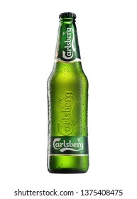 POLTAVA, UKRAINE - MARCH 22, 2019: Bottle Of Carlsberg beer on white background. Danish brewing company founded in 1847.
