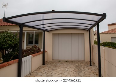 Polycarbonate carport on facade garage house like car patio pergola roof - Shutterstock ID 2244561921