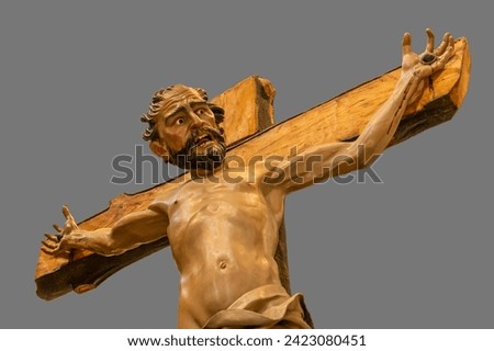 Polychrome wood carving of a thief crucified next to Christ. This wooden carving is part of the Calvary of Christ and goes out in procession during Holy Week in Zamora, Spain.
