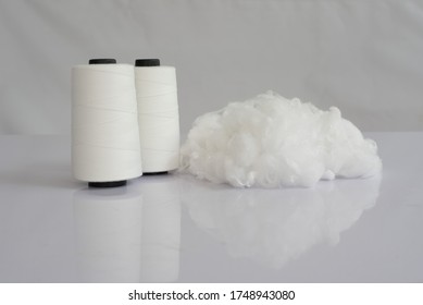 Polyester stable fiber & Raw White Polyester FDY Yarn spool with white background