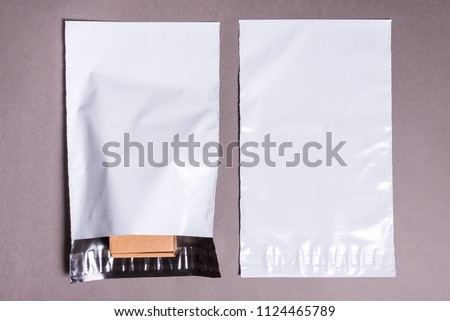 polyethylene envelope on grey background