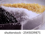 Polyethylene pellets for industrial use in plastic injection production.