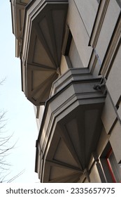 Polygonal massive balconies with geometric pattern decorated bottom