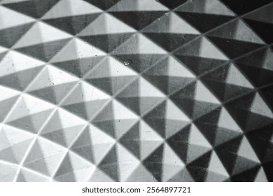 Polygonal texture and background in black and gray. geometric triangles