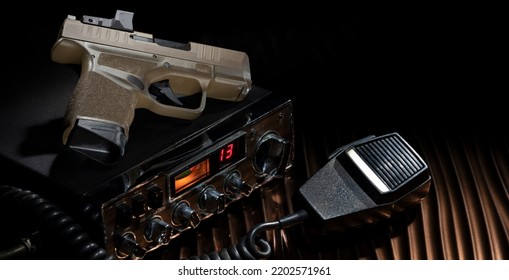 Polymer Handgun And CB Radio On A Bronze Colored Background