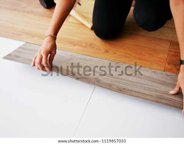 Polymer Product Wooden Vinyl Sheet Installing Stock Photo