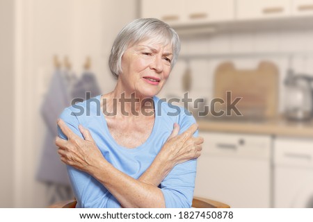 Image, Stock Photo Senior woman suffering from chest pain while her husband comforting her