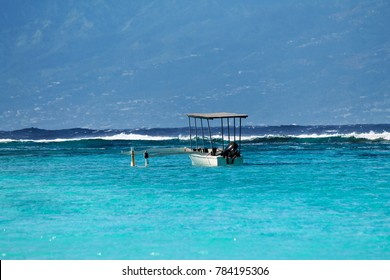 Polynesian Boat In The Sea Of Turquoise Arrefecife On The Island Of Moorea, French Polynesia