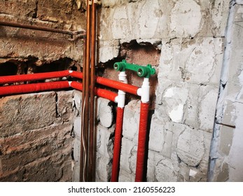 Polypropylene Plumbing Pipes In The Wall. New Construction Of The Bathroom, Installation Of Plastic Pipes With Insulation Inside The Wall