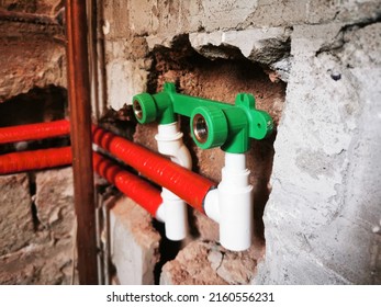 Polypropylene Plumbing Pipes In The Wall. New Construction Of The Bathroom, Installation Of Plastic Pipes With Insulation Inside The Wall