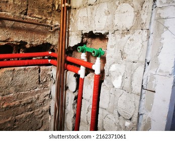 Polypropylene Plumbing Pipes In The Wall. New Construction Of The Bathroom, Installation Of Plastic Pipes With Insulation Inside The Wall